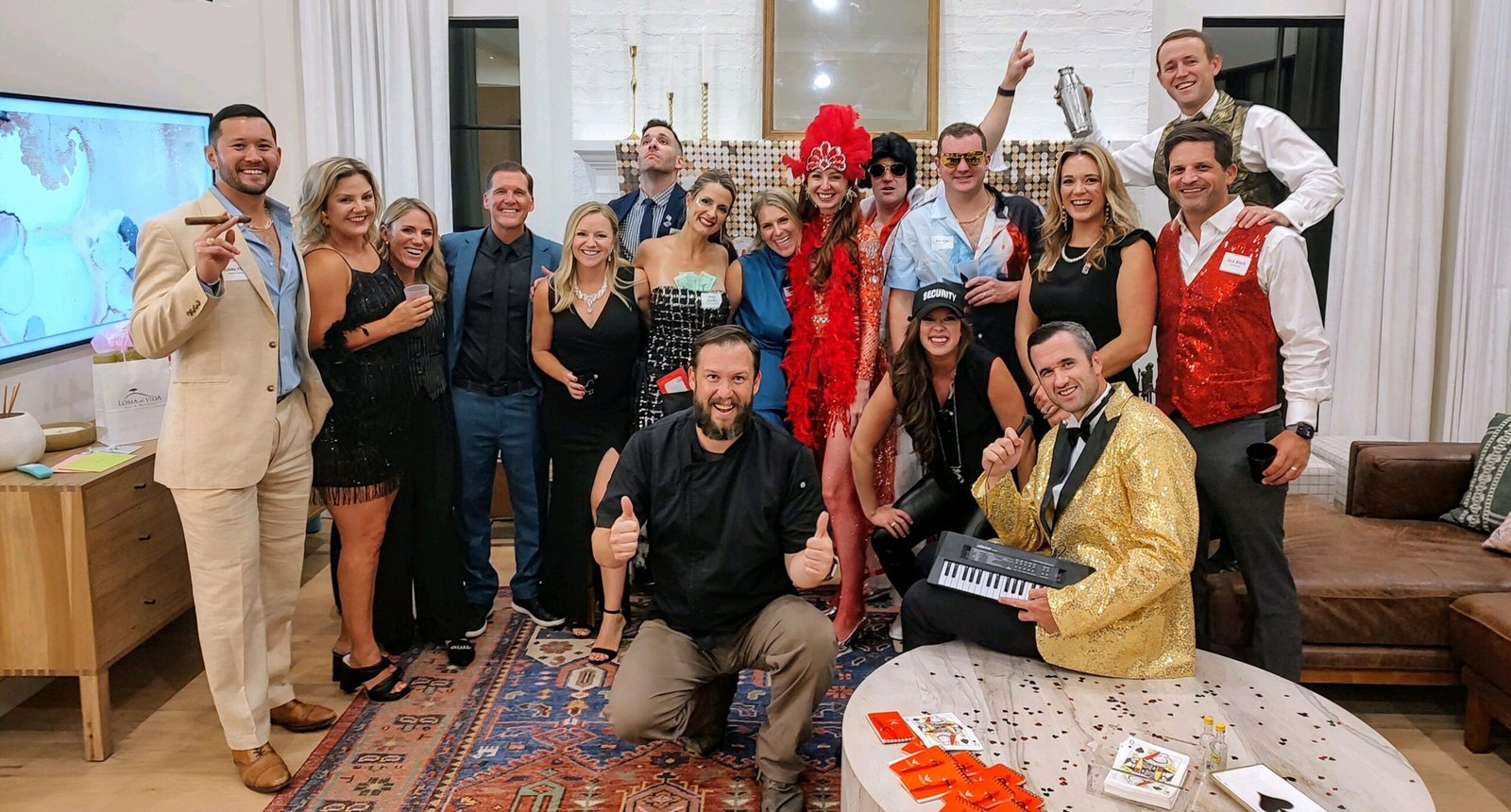 group of friends posing during the murder mystery party in various casino themed outfits