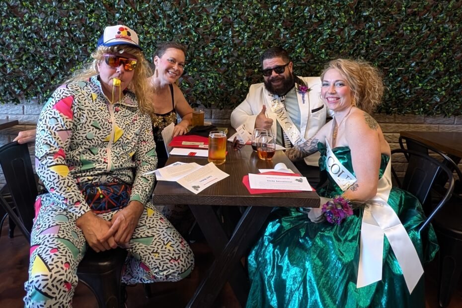 Group of friends dressed up for an 80s themed murder mystery party